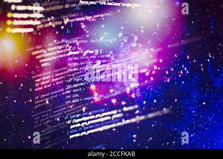 Programmer working in a software develop company office. Digital binary data on computer screen. Computer script typing work. Programming code abstrac Stock Photo