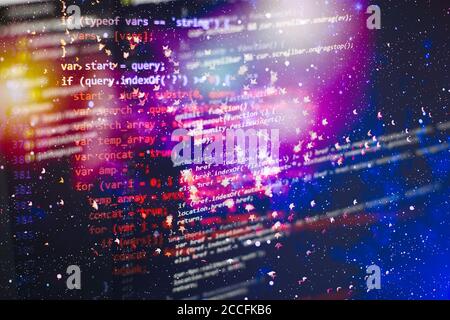 Programmer working in a software develop company office. Digital binary data on computer screen. Computer script typing work. Programming code abstrac Stock Photo