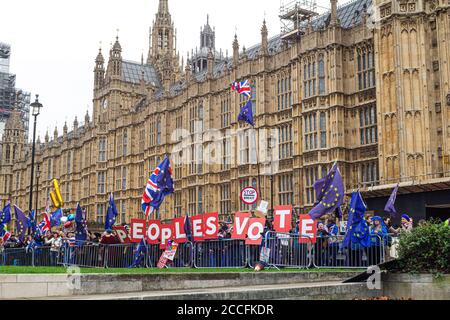 London,England. People's Vote campaigners outside the UK parliament surrounding College Green, the area traditionally reserved for media interviews, to make their voices heard and show off their EU flags on 10th December 2018.  Parliament is debating about the meaningful vote under PM Theresa May. Stock Photo