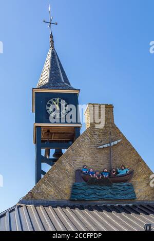 Hindeloopen, Friesland, Netherlands - August 5, 2020: Clock tower in the picturesque fishing village Hindeloopen in Friesland in the Netherlands Stock Photo