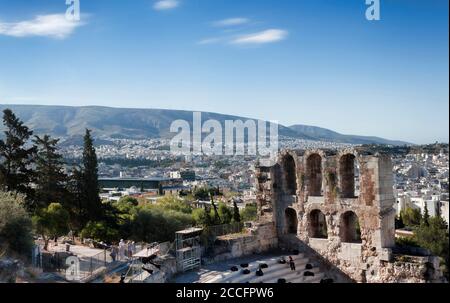 ATHENS, GREECE - JUNE 29, 2018: Fragment of Dionysus Theatre ruins on the Athens Acropolis against background of Athens panorama Stock Photo