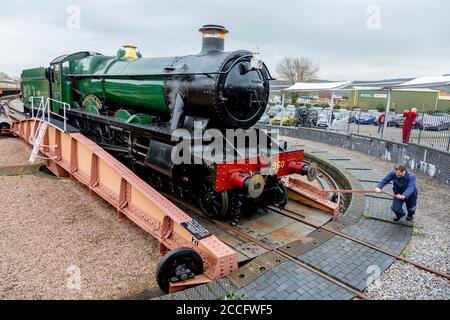 Ex-GWR steam loco 6960 'Raveningham Hall' on the turntable at Minehead, West Somerset Railway Spring Gala, England, UK Stock Photo