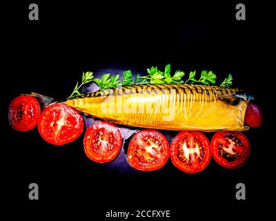 Smoked mackerel fish with tomatoes on a black background. Stock Photo