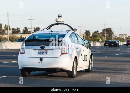 July 25, 2020 Fremont / CA / USA - Nuro autonomous vehicle driving on the freeway in Silicon Valley; Nuro is a robotics company founded by two ex Waym Stock Photo