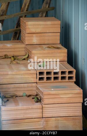 perforated masonry bricks ready for use on a construction site Stock Photo