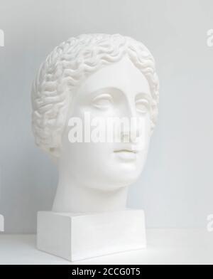 Gypsum statue of Venus head. Statue. Renaissance epoch. Gypsum copy of ancient statue Venus head isolated on black background. Plaster sculpture woman Stock Photo