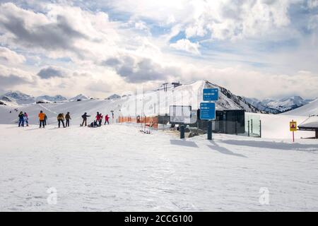 Saalbach, Austria - March 2, 2020: People skiing at ski slope of austrain winter resort Stock Photo