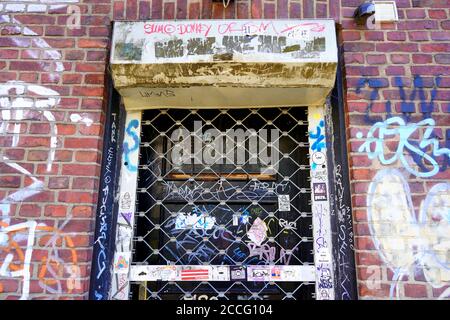 Abandoned entrance of a building with graffiti on the wall in Old Town Düsseldorf. Stock Photo