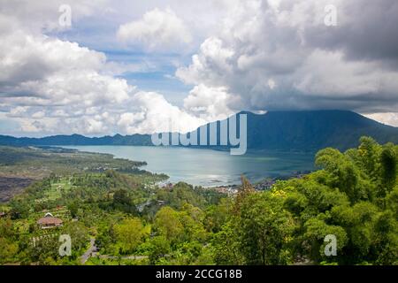 Lake Batur is a volcanic crater lake in Kintamani, Bali, in the northeast of the volcanic island. The lake is inside of the caldera of an active volca Stock Photo