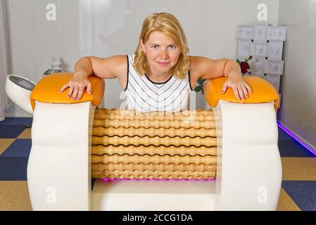 woman making massage for leg fits. Roll Massage machine is a way to shape  the figure. Skin Care, body care concept. modern relax massage equipment  Stock Photo - Alamy