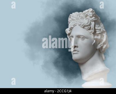 Renaissance. Renaissance interested in? Gypsum statue of Apollo's head. Man. Statue. Blue statue of Apollo's head. Creative. Clever. Apollo Belvedere Stock Photo