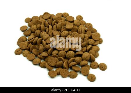 Dutch traditional baked pepernoten on a white background with copy space. Treats that are given to kids with sint Nicolas Stock Photo