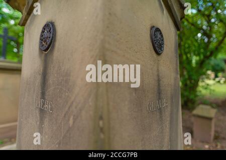 Inscription on gravestone: Love - Faith, Hoppenlaufriedhof or Hoppenlau Cemetery of 1626, Stuttgart, Baden-Württemberg, South Germany, Europe Stock Photo