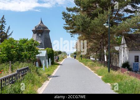 Germany, Mecklenburg-West Pomerania, Hiddensee, an old windmill stands on the dike in the fishing village of Vitte. Stock Photo