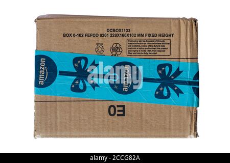 Amazon parcel package with Christmas tape isolated on white background Stock Photo