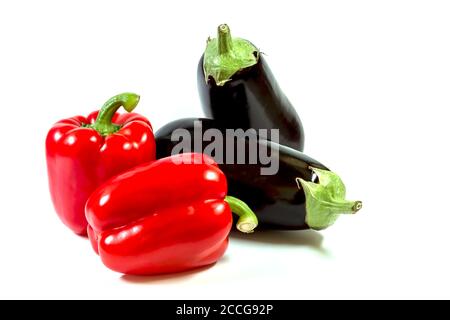 Isolated healty food, vegetable, two paprikas and two eggplants on a white background Stock Photo