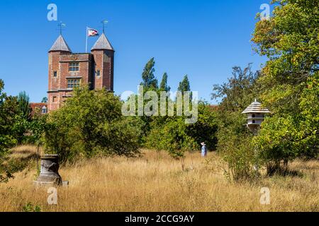 The Elizabethan Tower at Sissinghurst Castle from the orchard in summer, Kent, England Stock Photo