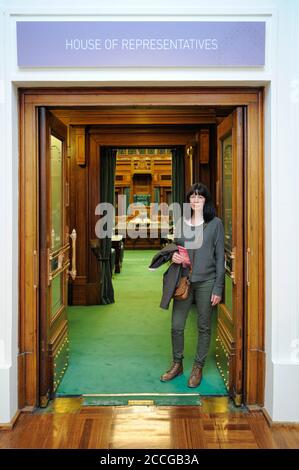 Female tourist in the doorway of the House of Representatives chamber, Old Parliament House in Canberra, Australian Capital Territory (ACT), Australia Stock Photo