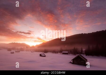 Sunrise in the Bavarian Alps near Garmisch-Partenkirchen. In the background the Sowendgruppe of the Karwendel and fantastic colors, in the foreground Stock Photo