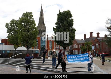 Leicester, Leicestershire, UK. 22nd August 2020. Demonstrators attend a ÒSave Our NHSÓ protest near a Covid-19 testing centre. The campaign aims to build a movement to fight for fair wages in the National Health Service. Credit Darren Staples/Alamy Live News. Stock Photo