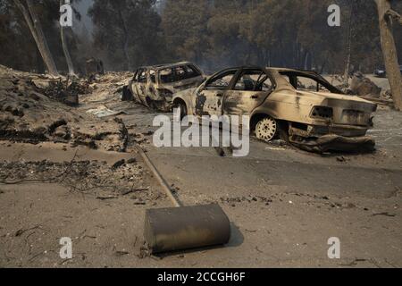 Boulder Creek, United States. 22nd Aug, 2020. The remains of a burnt home and vehicles in Boulder Creek, California as the CZU Lightning Complex fire continues to burn well into its fourth day with more than 50,000 acres torched, more than 100 structures destroyed and more than 75,000 people evacuated across two counties on Friday, August 21, 2020. Photo by Peter DaSilva/UPI Credit: UPI/Alamy Live News Stock Photo