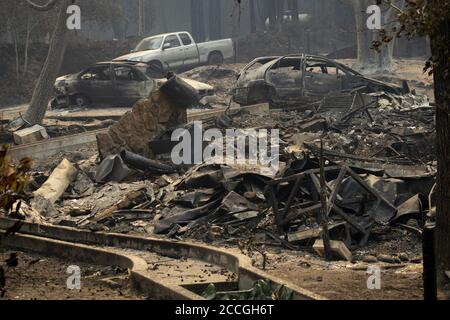 Boulder Creek, United States. 22nd Aug, 2020. The remains of a burnt down home and vehicles in Boulder Creek, California as the CZU Lightning Complex fire continues to burn well into its fourth day with more than 50,000 acres torched, more than 100 structures destroyed and more than 75,000 people evacuated across two counties on Friday, August 21, 2020. Photo by Peter DaSilva/UPI Credit: UPI/Alamy Live News Stock Photo