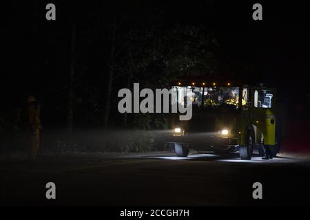 Boulder Creek, United States. 22nd Aug, 2020. Firefighters prepare to move to the next location after putting out hotspots in Boulder Creek, California as the CZU Lightning Complex fire continues to burn well into its fourth day with more than 50,000 acres torched, more than 100 structures destroyed and more than 75,000 people evacuated across two counties on Friday, August 21, 2020. Photo by Peter DaSilva/UPI Credit: UPI/Alamy Live News Stock Photo