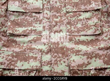 US army acu digital desert uniform shirt background, texture Military camouflage fabric textile closeup view, pocket detail Stock Photo