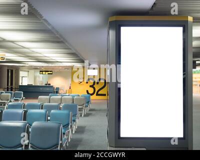 Airport advertising board sign concept : Big blank white advertising billboard screen frame at the airport with copy space in public place , passenger Stock Photo