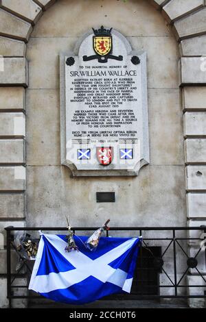 London, UK, April 30, 2011 : Memorial plaque to Sir William Wallace (Braveheart) outside St Bartholomew's Hospital in Smithfields with the Scottish Sc Stock Photo