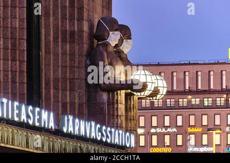 Helsinki, Finland - August 16, 2020: The 'Lantern Carriers' at Helsinki Central Railway Station was adorned with face masks during the COVID-19 pandem Stock Photo