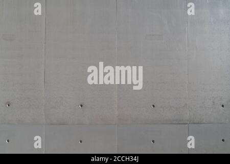 Straight-on view of solid smooth textured surface with horizontal and vertical lines and dot marks to the bottom Stock Photo