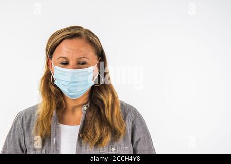 Young Mother Wearing Protective Face Mask During Corona Virus Epidemic Stock Photo