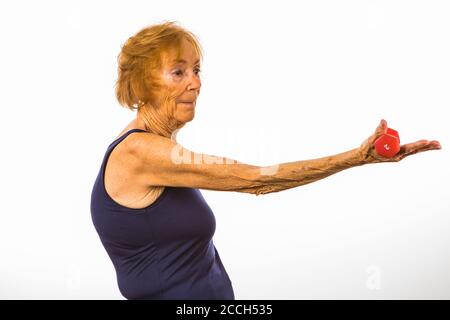 Senior Woman Holding Two Pound Dumbbell In Open Hand Stock Photo