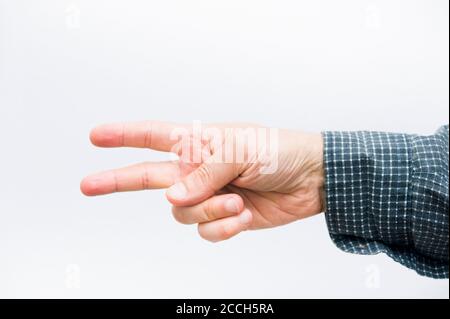 hand in gesture for the game of rock paper scissors,scissors gesture Stock Photo