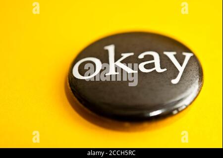 black button badge with word OKAY printed on it Stock Photo