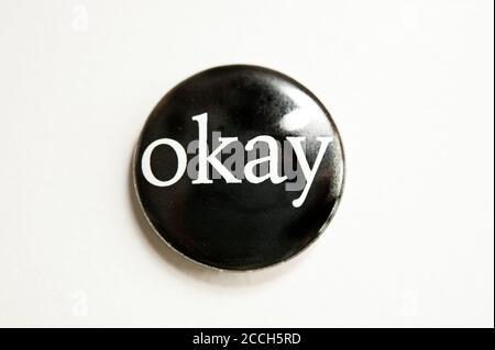 black button badge with word OKAY printed on it Stock Photo