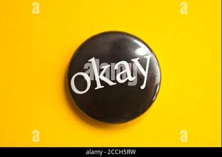 black button badge with word OKAY printed on it Stock Photo