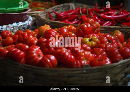 Pile of freshly harvested tomatoes in the market Stock Photo