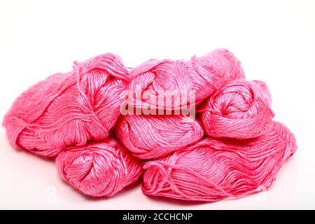 Balls of pink knitting wool isolated on a white background Stock Photo