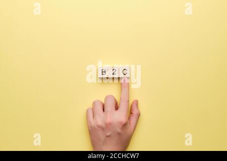 Concept business to consumer on wooden cubes. Stock Photo