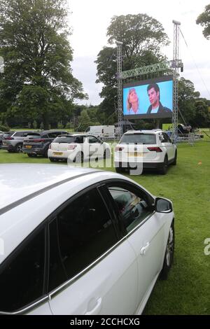 Ayr, Ayrshire, Scotland, UK, 22 August 2020 : Drive in movies come to Rozelle Park in Ayr. Families watching Grease starring John Tavolta & Oliva Newton John from the comfort of their cars  Alister Firth / Alamy Life News Stock Photo