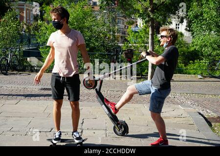 Ordinary life in the old district of Istanbul. two guys are riding along a  narrow street on one electric scooter. Turkey , Istanbul - 21.07.2020 Stock  Photo - Alamy