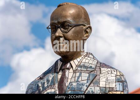 Statue of Eric Cole in housing estate on the site of the EKCO (from Eric Kirkham Cole Limited) British electronics company. Bronze with mosaic detail Stock Photo