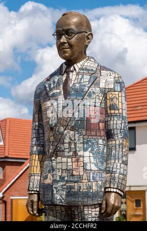 Statue of Eric Cole in housing estate on the site of the EKCO (from Eric Kirkham Cole Limited) British electronics company. Bronze and mosaic figure Stock Photo