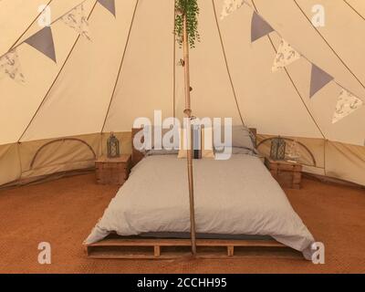A bell tent set up in the countryside for some up market camping Stock Photo
