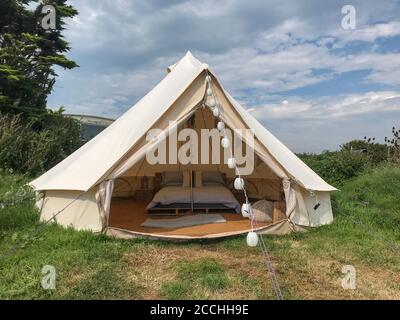 A bell tent set up in the countryside for some up market camping Stock Photo