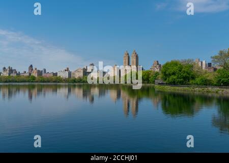 Central Park West Residences reflect to the Central Park Reservoir Stock Photo