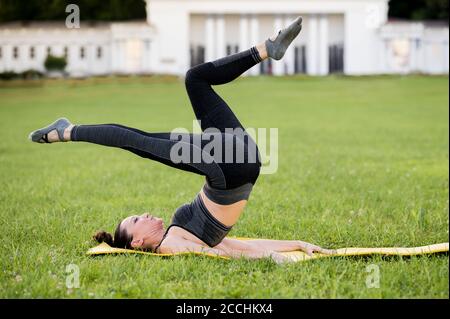 Athletic Young Girl Exercising, Doing Criss-cross Exercises, Bicycle Crunch  Pose, Exercising, Wearing Sportswear, Gray Stock Photo - Image of  lifestyle, strength: 213807878