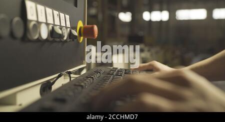 Factory Engineer Operating Hydraulic Tube Bender Stock Photo